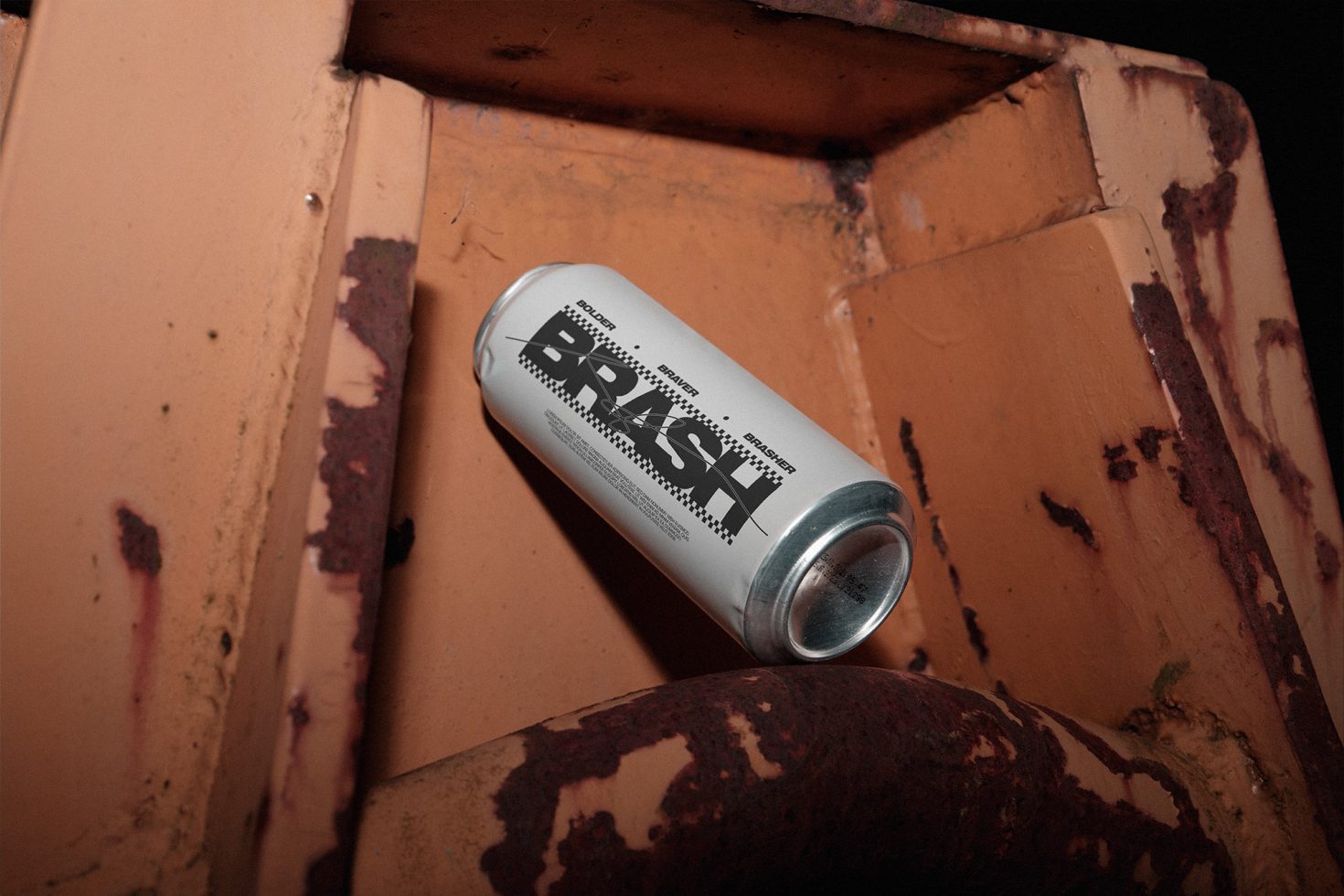 Spray paint can mockup on rusty background, ideal for presenting graffiti font or urban graphic designs in a realistic setting.